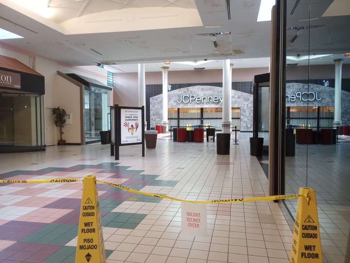 that same marble & tile storefront, roped off by caution tape