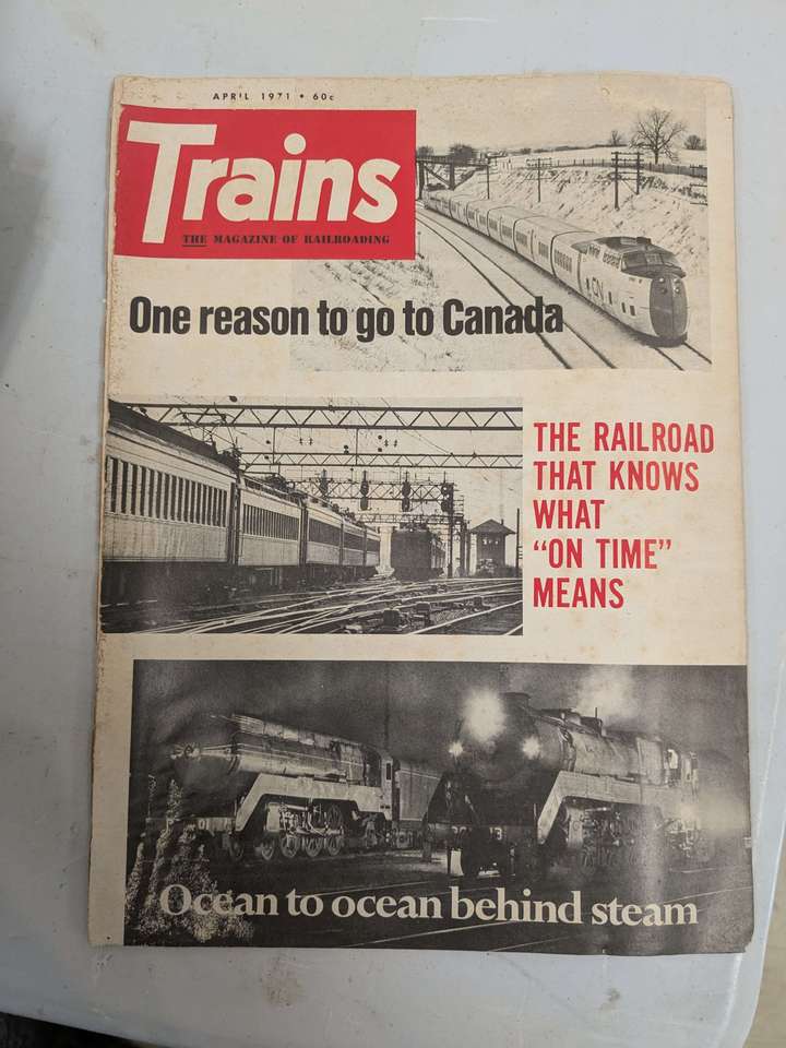 A black, white, and red cover of a vintage railroading magazine