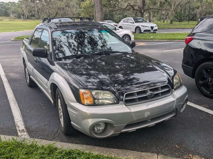 A four-door dark blue ute