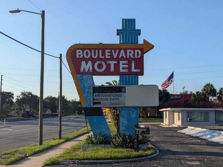 A weathered neon hotel sign