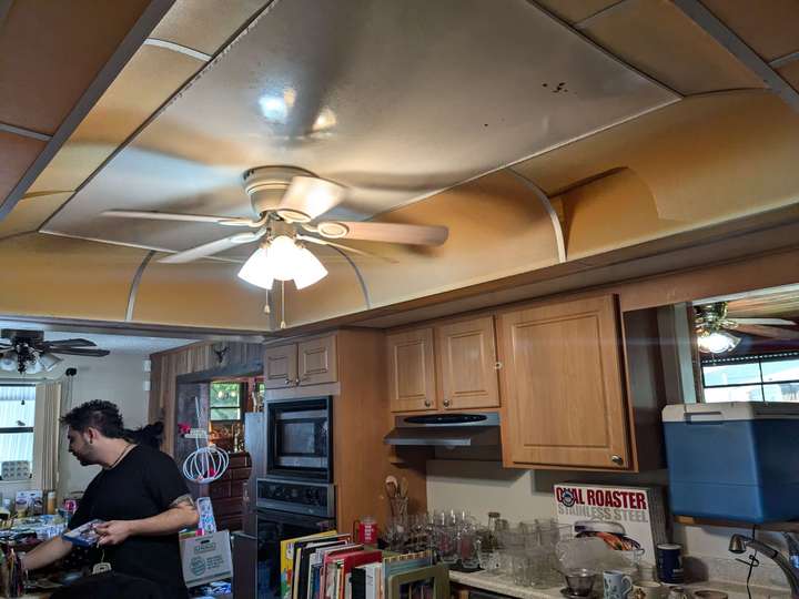 A kitchen ceiling with a embossed roof