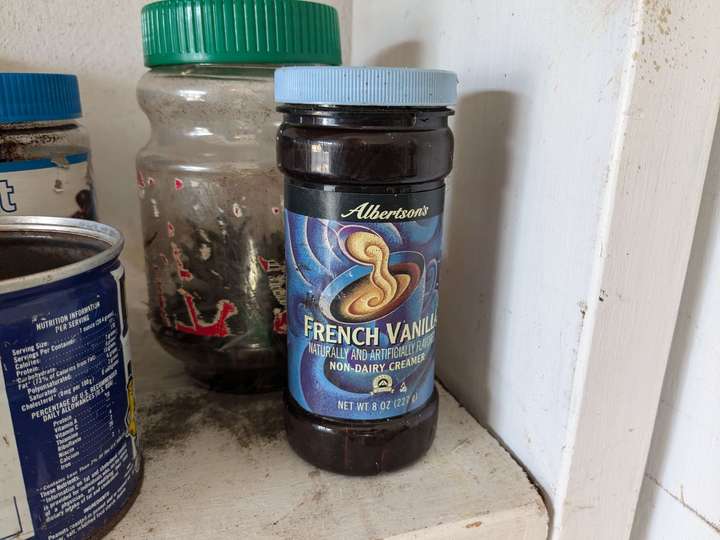 An empty jar of store brand vanilla non-dairy creamer