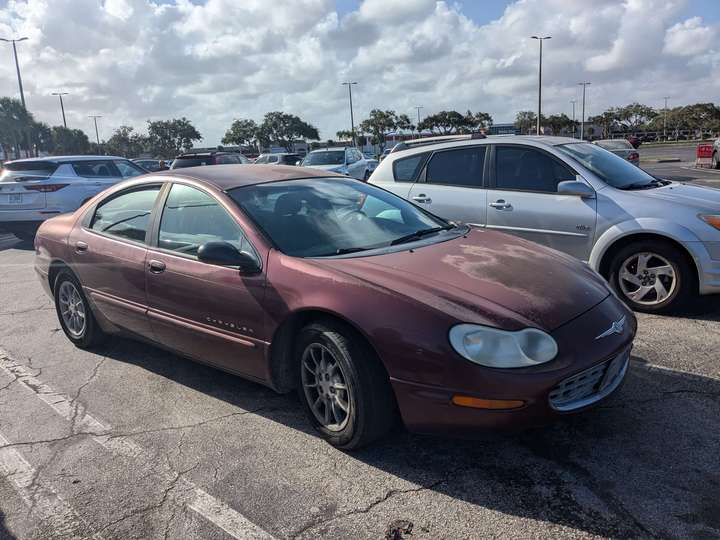 A weathered full red full size sedan