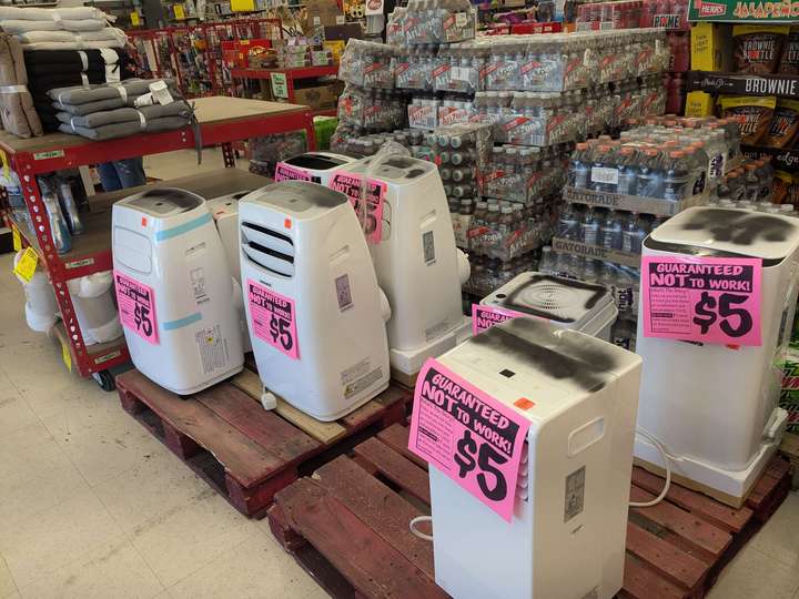 Two pallets of non-functional A/Cs and dehumidifiers