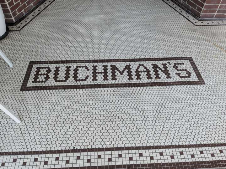 BUCHMAN'S is spelled in simple tile, outlined