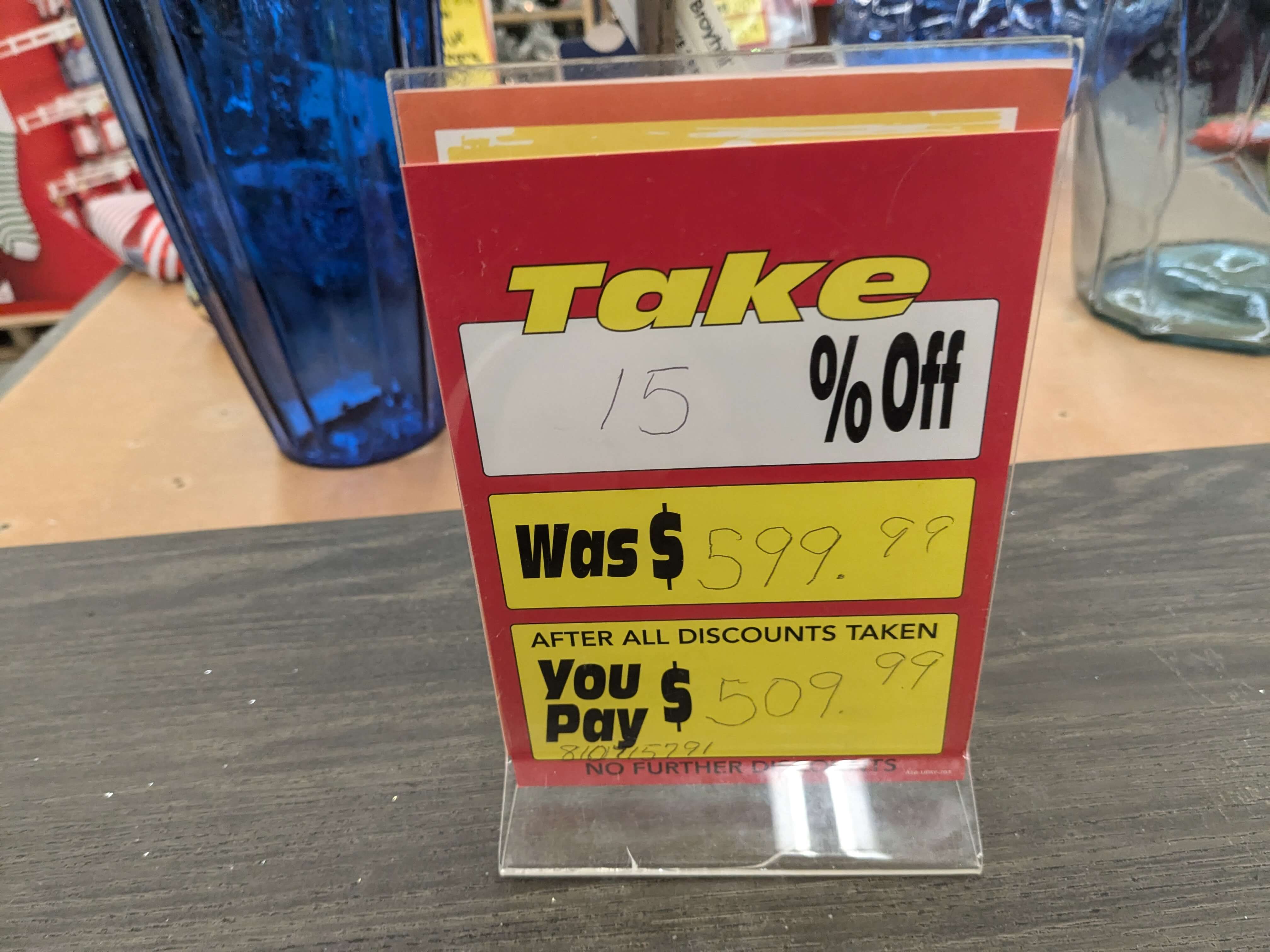 A discount placard showing a 15% discount on a $500+ piece of furniture