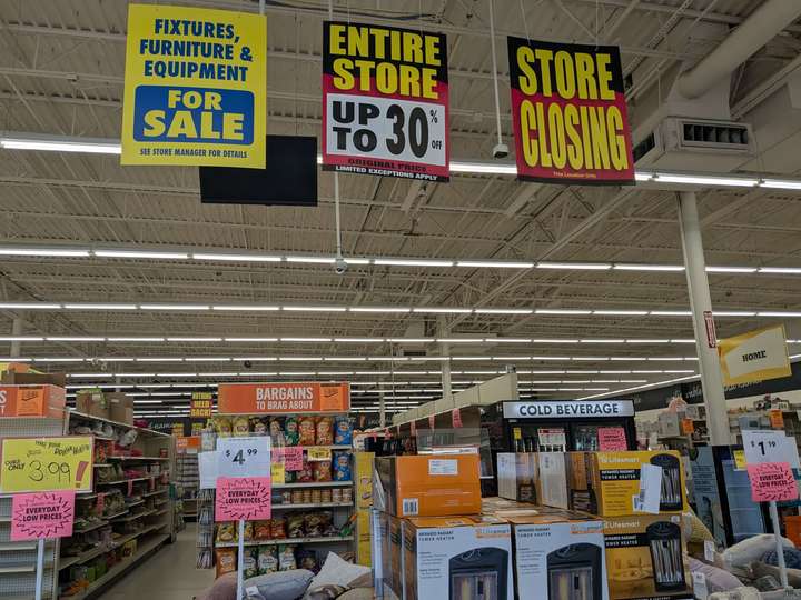 A view of the store interior, pitched up to show Store Closing signs