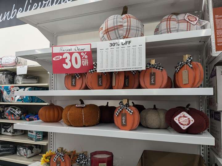 A view of an endcap containing discounted Halloween decor