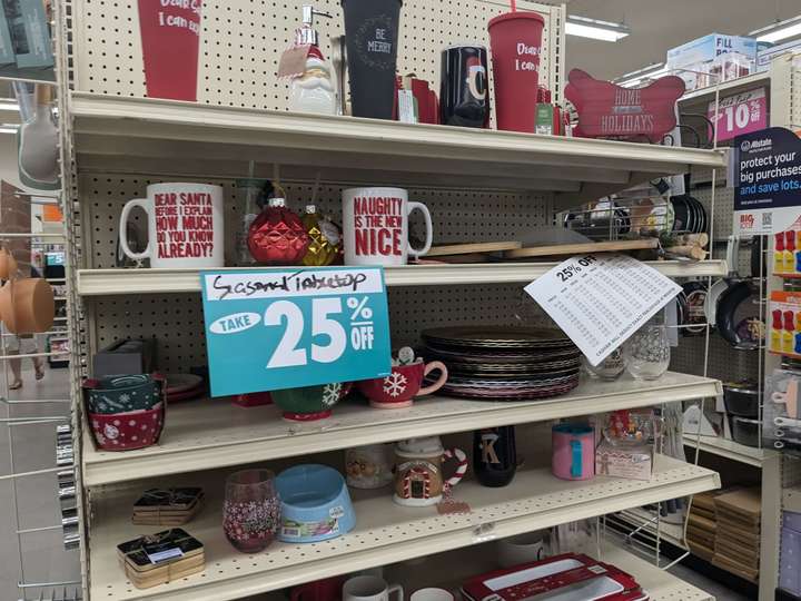 An end cap of discounted Christmas merchandise