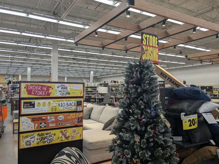 A view of a stand showing promotions and a christmas tree