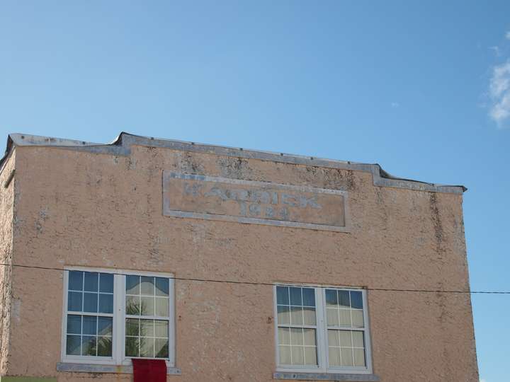 A closeup of the word Karrick in weathered white text