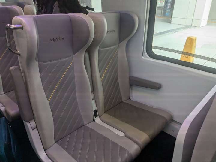 A view of 2 light gray seats