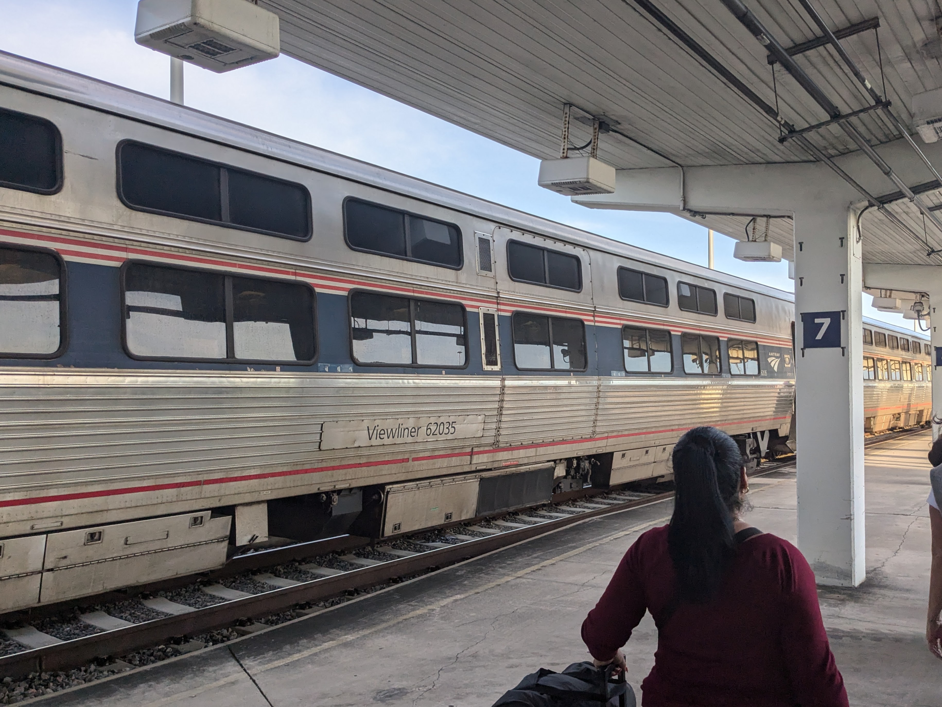 A view of a dual-level stainless steel passenger car